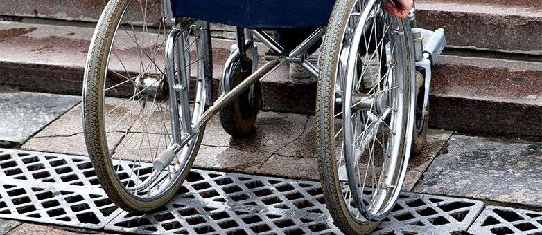 Wheelchair stuck at a set of stairs 