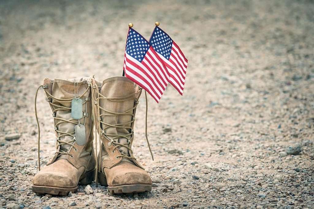 Soldiers boots with American flags inside them